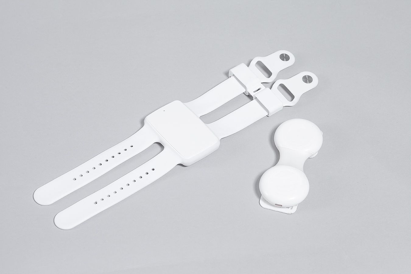 TOKO wrist module and chest patch flat lay